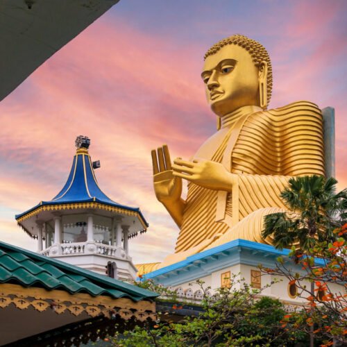 golden buddha statue in dambulla temple in sri lanka