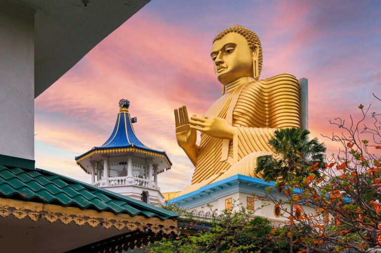 golden buddha statue in dambulla temple in sri lanka